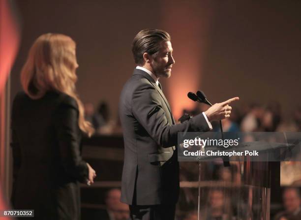 Actor Amy Adams and honoree Jake Gyllenhaal, recipient of the Hollywood Actor Award for 'Stronger,' speak onstage during the 21st Annual Hollywood...