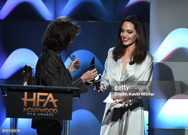Honoree Angelina Jolie accepts the Hollywood Foreign Language Film Award for 'First They Killed My Father' from actor Jacqueline Bisset onstage...
