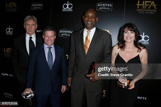 Actor Harrison Ford and honorees Andrew A. Kosove, Broderick Johnson, and Cynthia Sikes Yorkin, recipients of the Hollywood Producer Award for 'Blade...