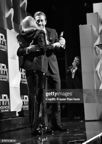 Honoree Jake Gyllenhaal accepts the Hollywood Actor Award for 'Stronger' from actor Amy Adams onstage at the 21st Annual Hollywood Film Awards at The...