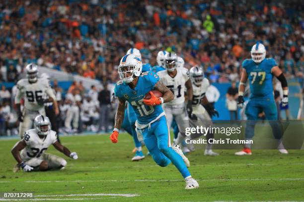 Wide receiver Kenny Stills of the Miami Dolphins rushes with the ball during a game against the Oakland Raiders at Hard Rock Stadium on November 5,...