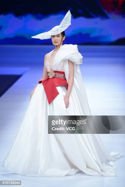 Model showcases designs on the runway at Maryma collection by designer Ma Yanli during the Mercedes-Benz China Fashion Week Spring/Summer 2018 at...