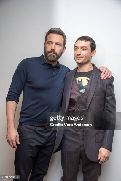 Ben Affleck and Ezra Miller at the "Justice League" Press Conference at The Rosewood Hotel on November 4, 2017 in London, England.