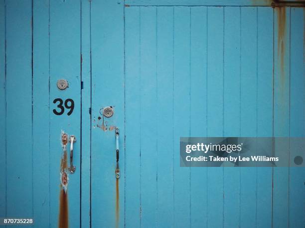 blue wooden boat house door - boathouse stock pictures, royalty-free photos & images