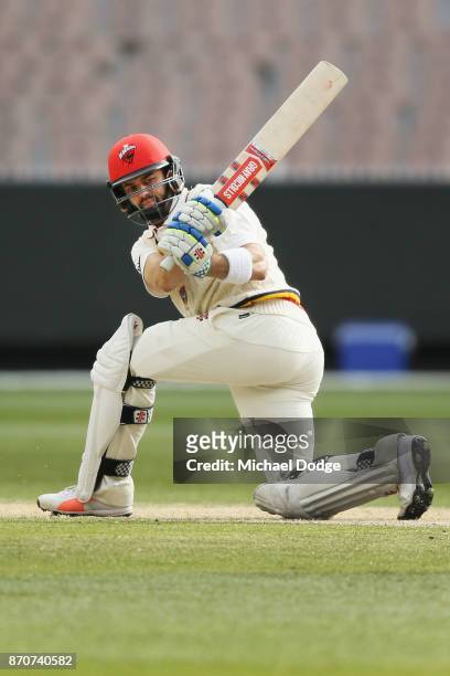 Callum Ferguson of South Australia sweeps the ball past Keeper Sam Harper of Victoria during day three of the Sheffield Shield match between Victoria...