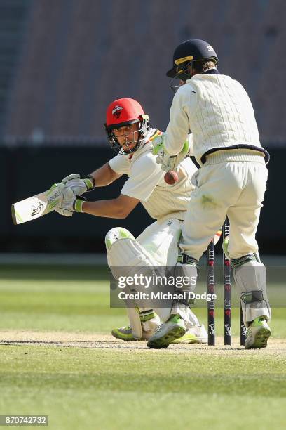 Jake Lehmann of South Australia only just cuts the ball late past the gloves of Victoria keeper Sam Harper during day three of the Sheffield Shield...