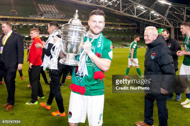 Steven Beattie of Cork celebrates with a trophy during the Irish Daily Mail FAI Senior Cup Final between Dundalk FC and Cork City at Aviva Stadium in...