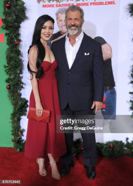 Mel Gibson and Rosalind Ross arrive at the premiere of Paramount Pictures' "Daddy's Home 2" at Regency Village Theatre on November 5, 2017 in...