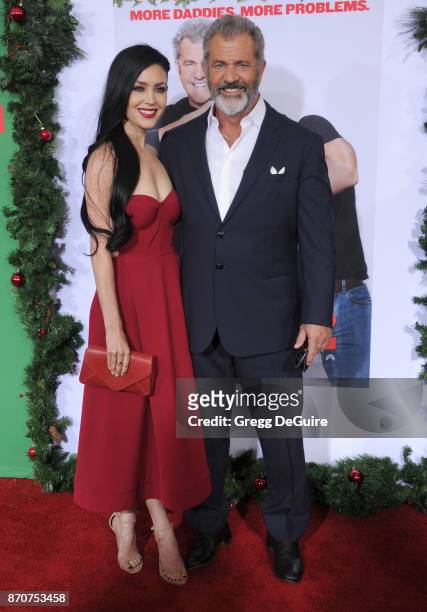 Mel Gibson and Rosalind Ross arrive at the premiere of Paramount Pictures' "Daddy's Home 2" at Regency Village Theatre on November 5, 2017 in...