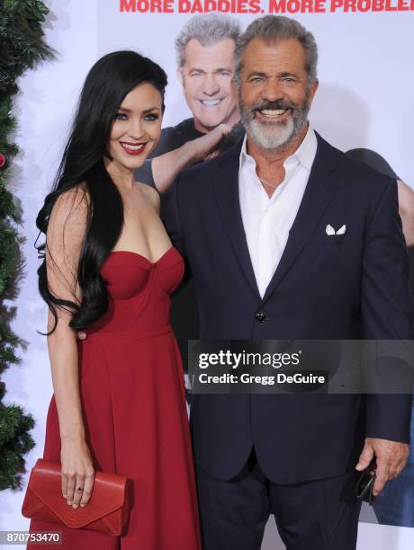 Mel Gibson and Rosalind Ross arrive at the premiere of Paramount Pictures' "Daddy's Home 2" at Regency Village Theatre on November 5, 2017 in...