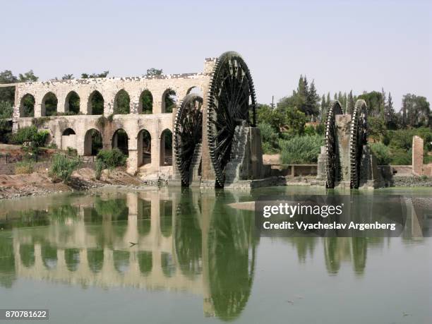 the orontes river and norias of hama - norias stock pictures, royalty-free photos & images