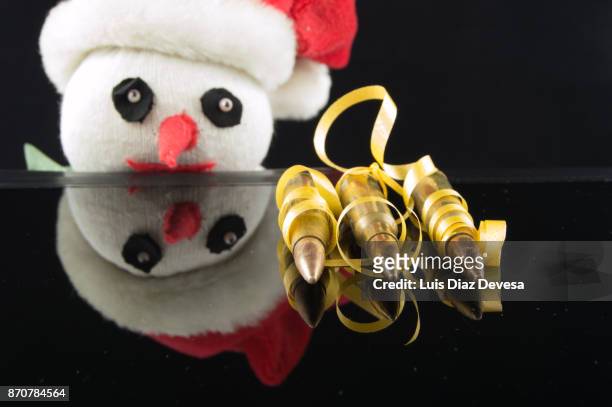 don't give arms and ammunition - machine christmas tree stock pictures, royalty-free photos & images