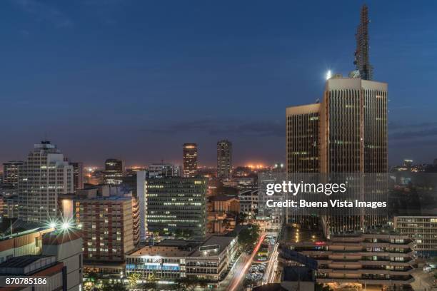 modern buildings downtown nairobi. - nairobi night stock pictures, royalty-free photos & images