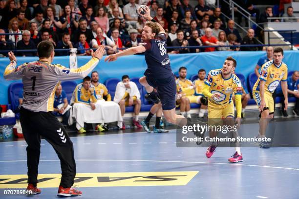 Jesper Nielsen of Paris Saint Germain is shooting the ball against Slawomir Szmal of PGE Vive Kielce during the Champions League match between Paris...