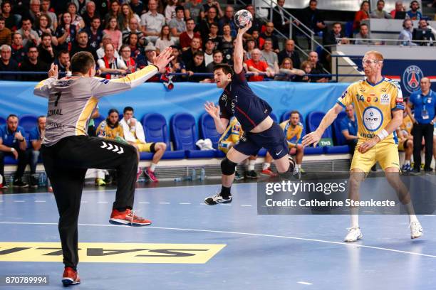 Edouard Kempf of Paris Saint Germain is shooting the ball against Slawomir Szmal of PGE Vive Kielce during the Champions League match between Paris...