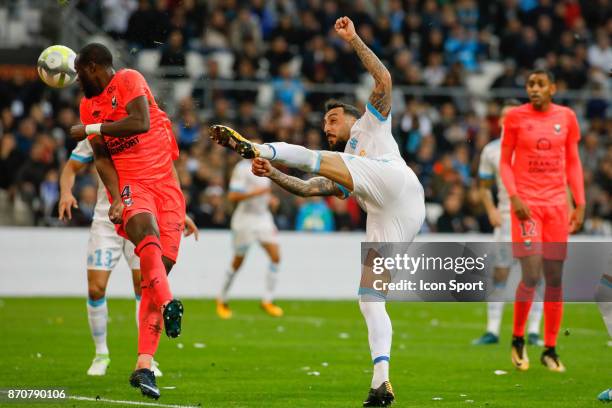 Ismael Diomande of Caen and Konstantinos Mitroglou of Marseille during the Ligue 1 match between Olympique Marseille and SM Caen at Stade Velodrome...
