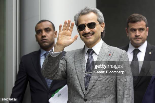 Prince Alwaleed Bin Talal, Saudi billionaire and founder of Kingdom Holding Co., center, waves as he arrives to give evidence at the High Court in...