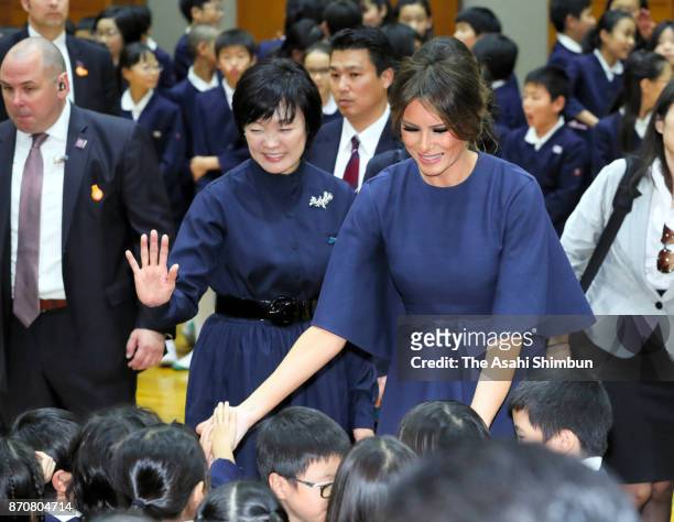 Melania Trump, wife of U.S. President Donald Trump and Akie Abe, wife of Japanese Prime Minister Shinzo Abe, talk with school children during their...
