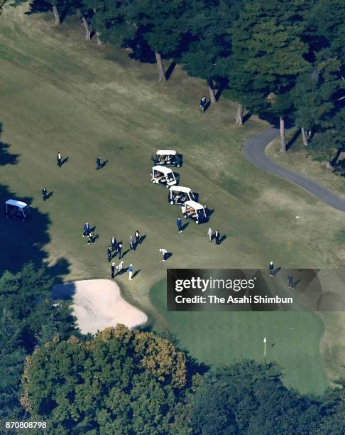 In this aerial image, U.S. President Donald Trump plays golf with Japanese Prime Minister Shinzo Abe and Hideki Matsuyama at Kasumigaseki Country...