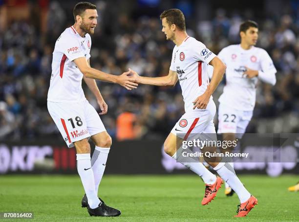 Oriol Riera of the Wanderers is congratulated by Robert Cornthwaite after kicking a goal scoring a goal during the round five A-League match between...