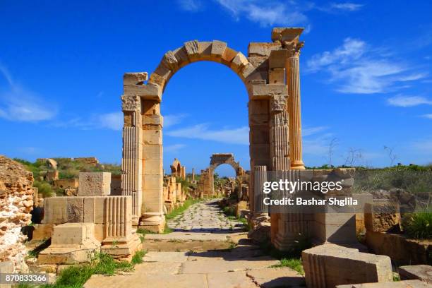 the arch of trajan - ruins of leptis magna stock pictures, royalty-free photos & images
