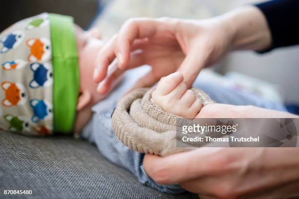 Berlin, Germany An infant is getting dressed on October 17, 2017 in Berlin, Germany.