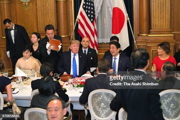 President Donald Trump, his wife Melania, Japanese Prime Minister Shinzo Abe and his wife Akie attend the dinner hosted by Abe at the prime...