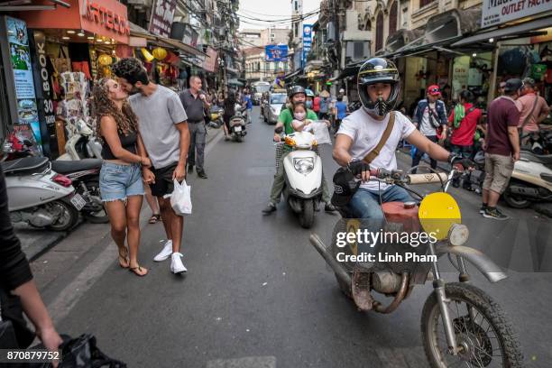 Le Viet Bach, 26 - a Minsk motorcycle enthusiast, pratices new tricks on the street in preparation for an off-road tournament on the following day on...