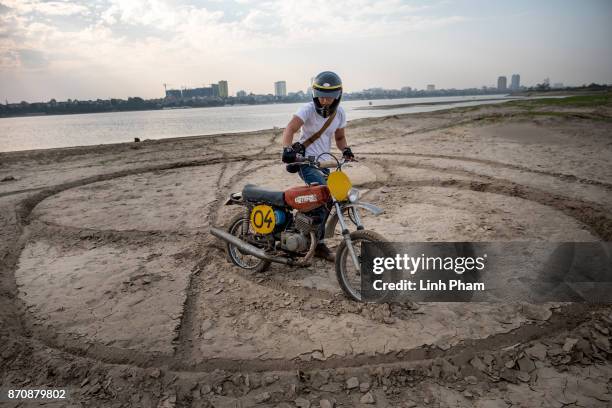 Le Viet Bach, 26 - a Minsk motorcycle enthusiast, pratices on the dirt track in preparation for an off-road tournament on the following day on...