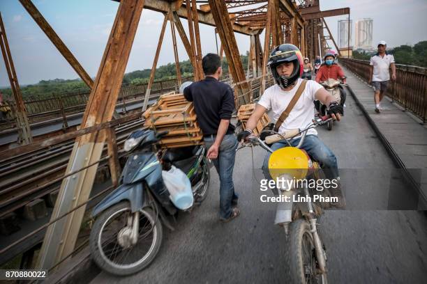 Le Viet Bach, 26 - a Minsk motorcycle enthusiast, pratices new tricks on the street in preparation for an off-road tournament on the following day on...