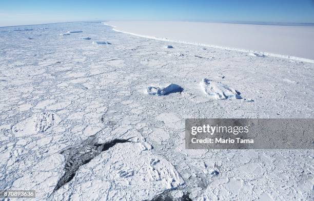 The western edge of the famed iceberg A-68 , calved from the Larsen C ice shelf, is seen from NASA's Operation IceBridge research aircraft, near the...