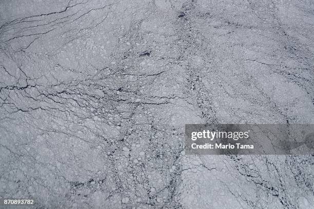 Sea ice floats, as seen from NASA's Operation IceBridge research aircraft, off the coast of the Antarctic Peninsula region, on November 3 above...