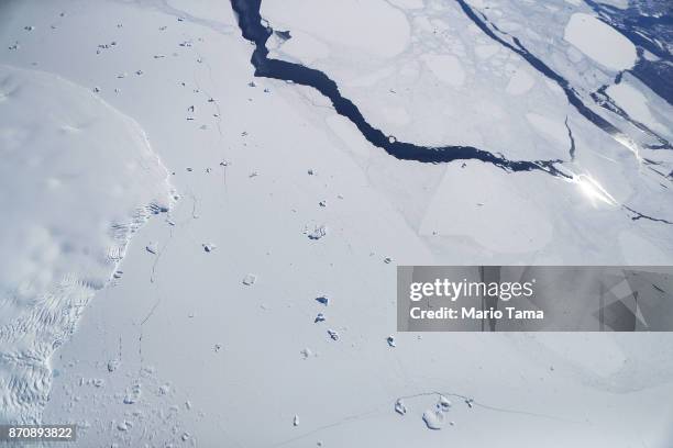 Sea ice and icebergs float as seen from NASA's Operation IceBridge research aircraft off the coast of the Antarctic Peninsula region, on November 3...