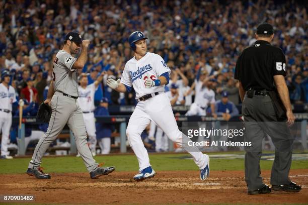 World Series: Los Angeles Dodgers Chase Utley victorious after scoring run vs Houston Astros Josh Reddick at Dodger Stadium. Game 6. Los Angeles, CA...