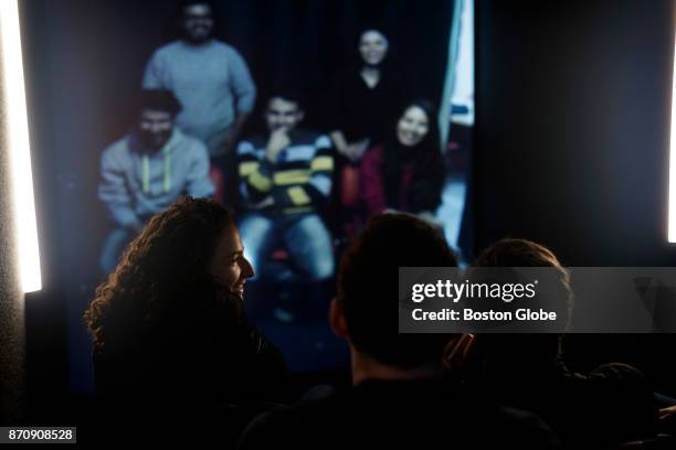 Group of graduate students from Harvard University speak via video conference with a group from Gaza City from a shipping container parked near the...