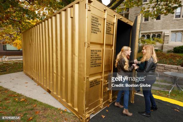 Curators Shannon Boley left, and Dorie Goehring, right, stand outside of the Portal installation at the Harvard Divinity School in Cambridge, MA on...