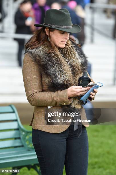 Racegoer attends race day at Ascot Racecourse on November 4, 2017 in Ascot, England.