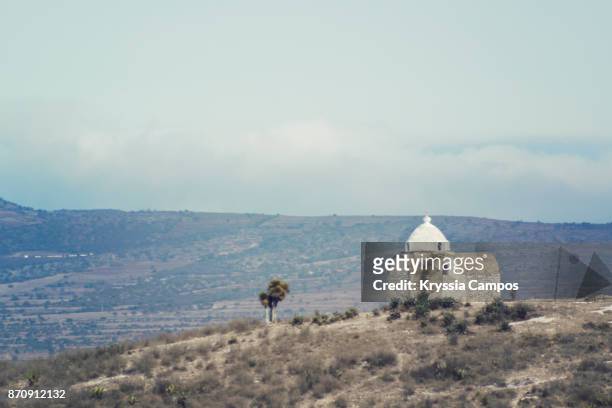 a small chapel in landscape along highway in mexico - puebla mexico fotografías e imágenes de stock