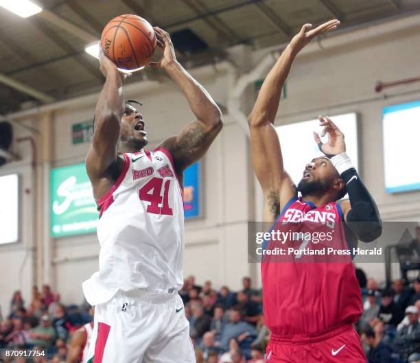 Maine Red Claws vs Delaware 87ers. Devin Williams of Maine puts up a shot over Shane Edwards of Delaware in the third period.