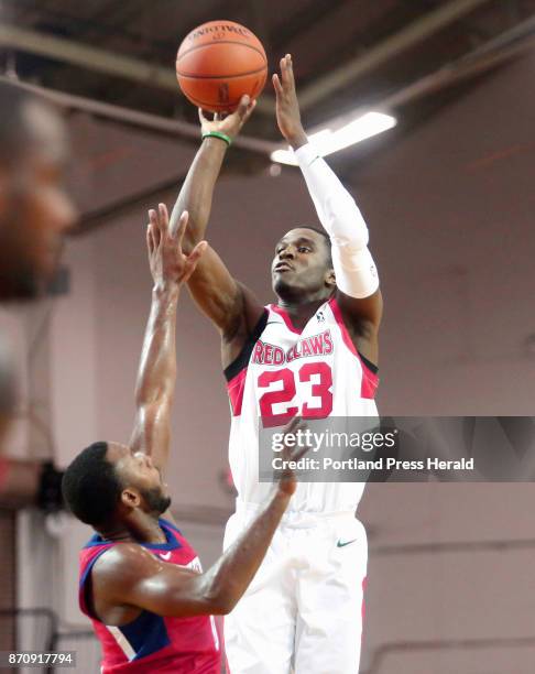 Maine Red Claws vs Delaware 87ers. Jabari Bird of Maine pulls up to drain a three-point shot over Jacob Pullen of Delaware in the second period.