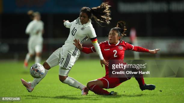 Gia Corley of Germany and Sofie Tranholm of Denmark compete for the ball during the U16 Girls international friendly match betwwen Denmark and...