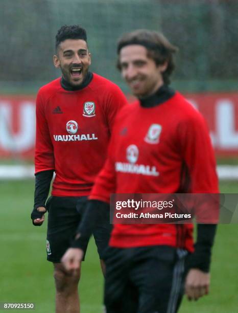 Neil Taylor and Joe Allen in action during the Wales Training Session at The Vale Resort on November 06, 2017 in Cardiff, Wales.