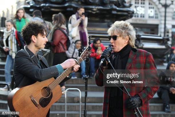 Rod Stewart seen busking at Piccadilly Circus with fellow busker Henry Facey on November 6, 2017 in London, England.
