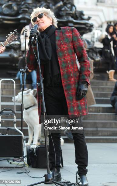 Rod Stewart seen busking at Piccadilly Circus with fellow busker Henry Facey on November 6, 2017 in London, England.