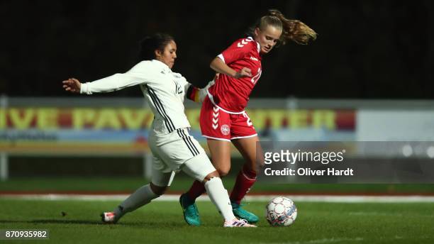 Gia Corley of Germany and Emilie Pruesse of Denmark compete for the ball during the U16 Girls international friendly match betwwen Denmark and...
