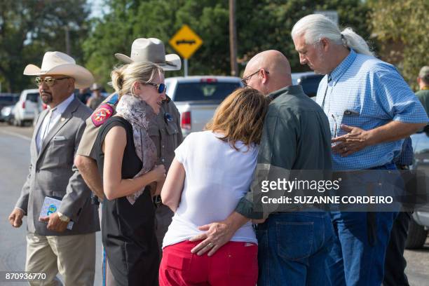 Pastor Frank Pomeroy comforts his wife Sherri following a press conference on November 6, 2017 at the First Baptist Church in Sutherland Springs,...