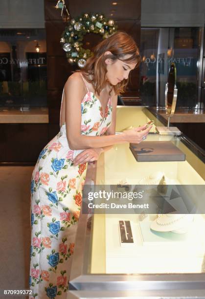 Alexa Chung sparkles inside the Tiffany & Co. Old Bond Street Store as she unveils the Tiffany Christmas windows at Tiffany & Co on November 6, 2017...