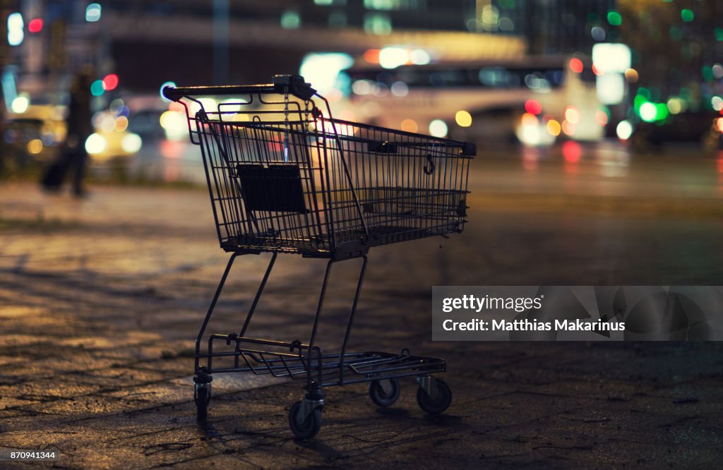 Urban City Street Night Szene with Shopping Cart and Traffic Lights