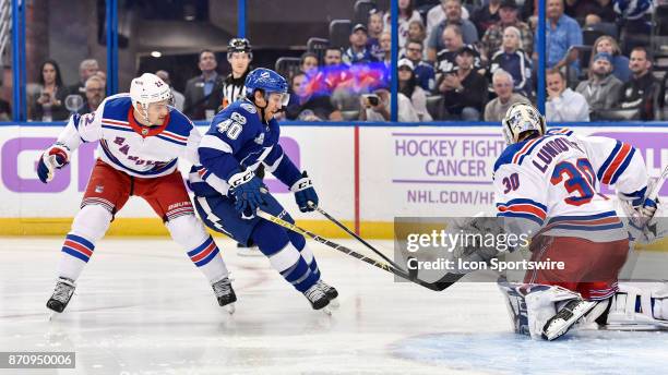 Tampa Bay Lightning center Gabriel Dumont drives the net while New York Rangers defender Kevin Shattenkirk defends during the first period of an NHL...