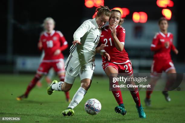 Luca von Achten of Germany and Emilie Pruesse of Denmark compete for the ball during the U16 Girls international friendly match betwwen Denmark and...